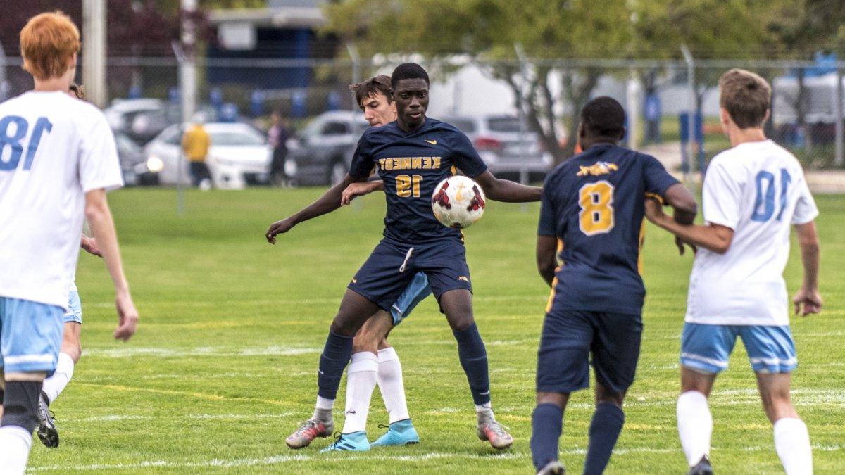 Kennedy boys soccer players during gameplay